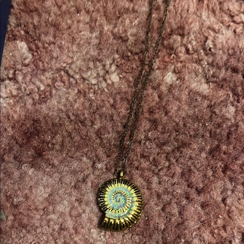 Gold Spiral Pendant Necklace lights up in the dark and come with a little light